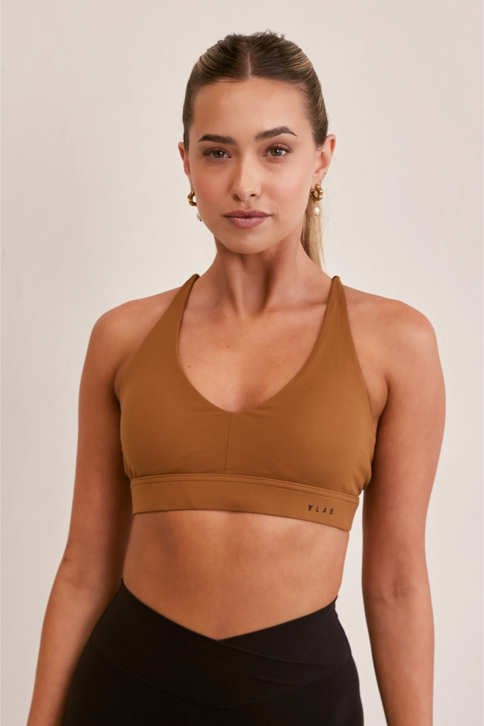 Model wearing Ylab Aura Active Sports Bra in Cinnamon
