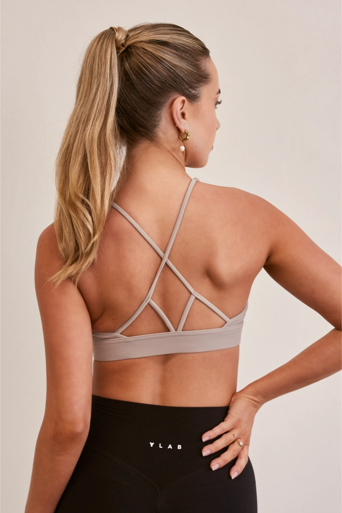 Model wearing Ylab Aura Active Sports Bra in Stone