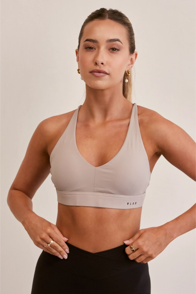 Model wearing Ylab Aura Active Sports Bra in Stone