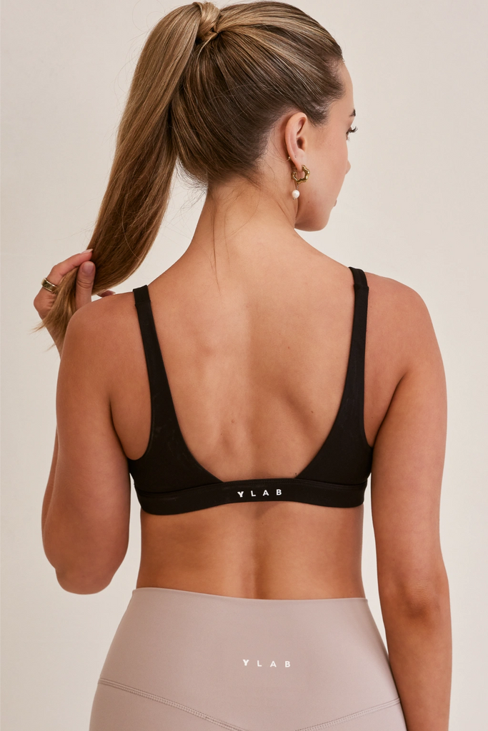 Model wearing YLab Luna Lift Sports Bra in Black