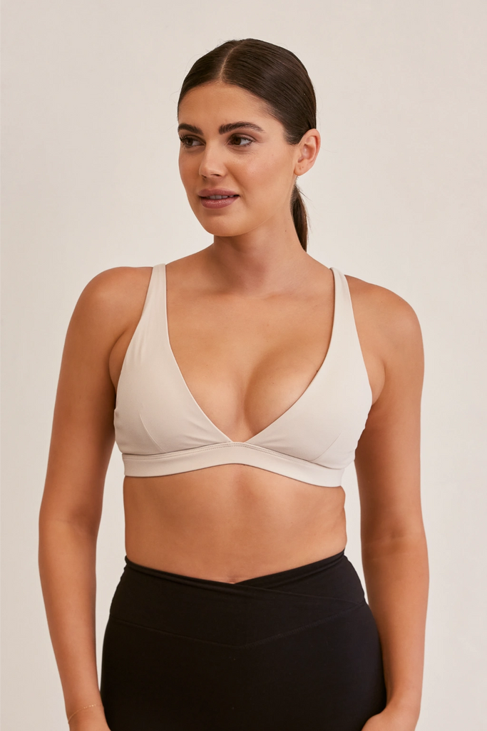 Model wearing YLab Luna Lift Sports Bra in Cream