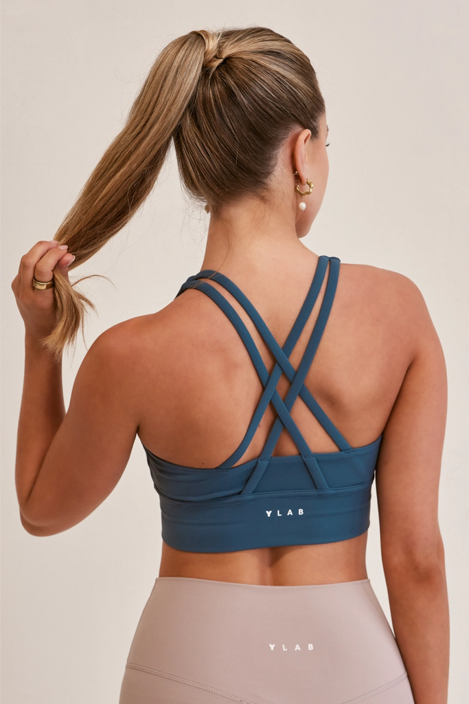 Model wearing Ylab Luxe Motion Sports Bra in Steel Blue