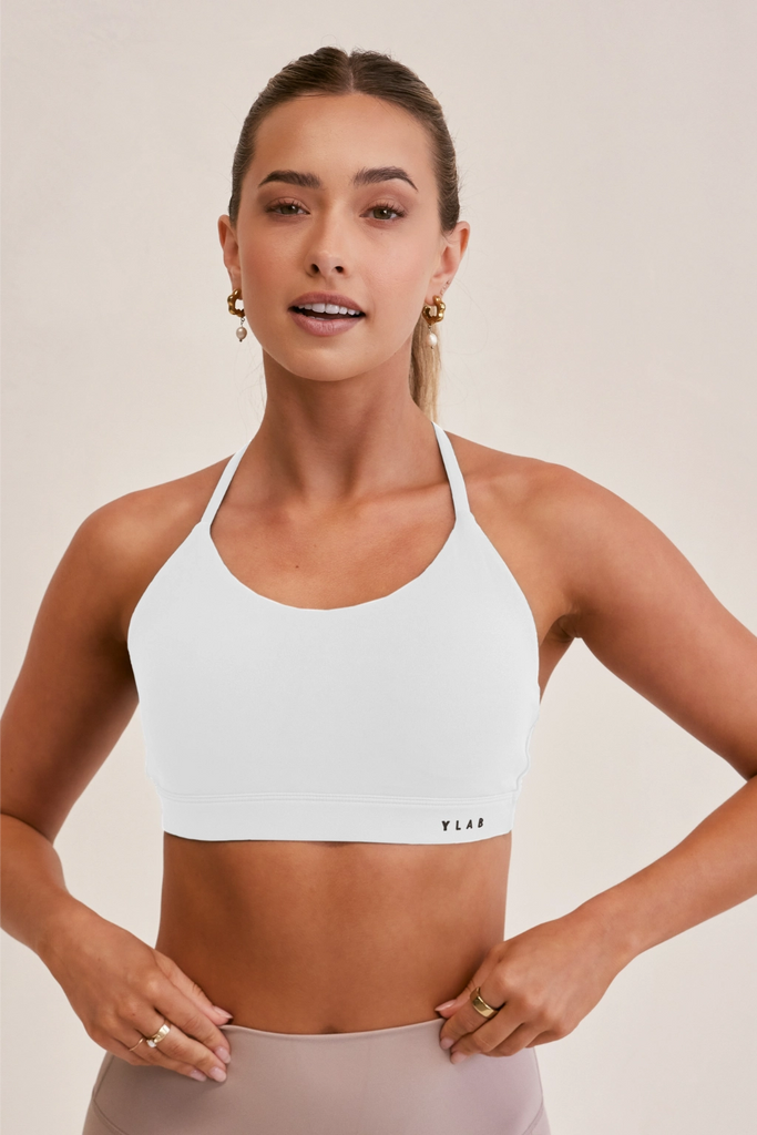 Model wearing YLAB Precision Sports Bra in White