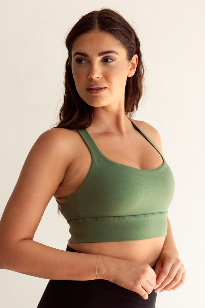 Model wearing Pure Elevation Sports Bra in Basil