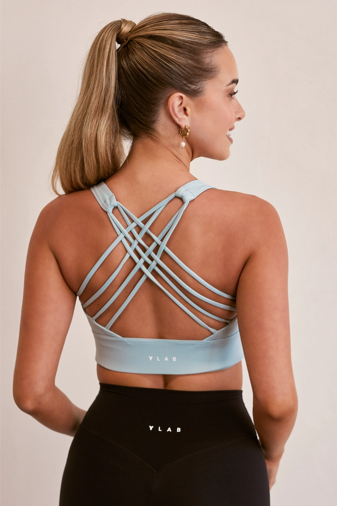 Model wearing Pure Elevation Sports Bra in Sky Blue