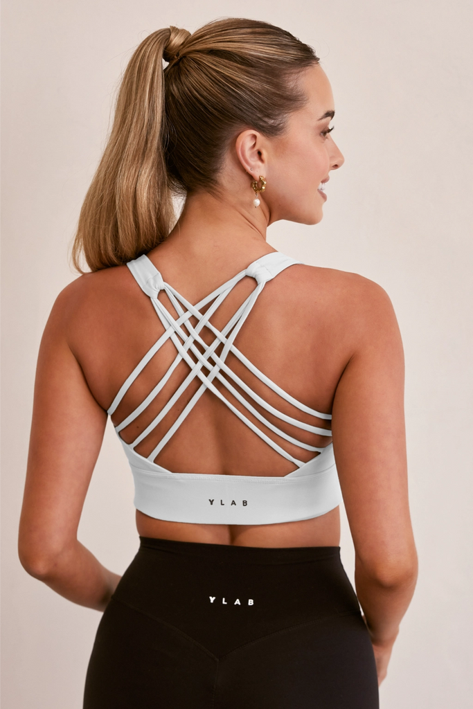 Model wearing YLAB Pure Elevation Sports Bra in White
