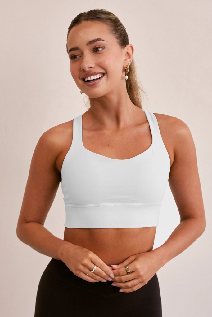 Model wearing YLAB White Pure Elevation Sports Bra in White