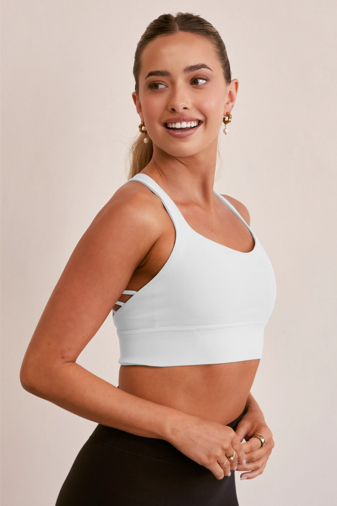 Model wearing YLAB Pure Elevation Sports Bra in White