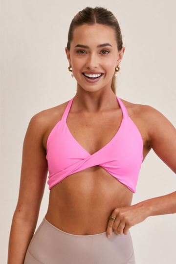 Model wearing YLAB Ultra Fusion Sports Bra in Candy